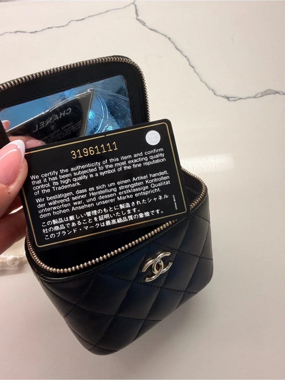 CHANEL Black Quilted Vanity Mini Bag with Pearl Strap